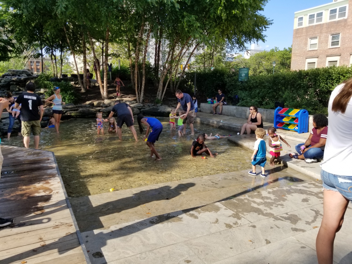 Children enjoying the pond at Sister Cities Park