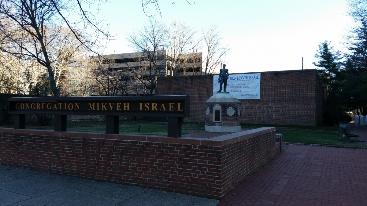 Mikveh Israel as seen from Independence Mall with statue of Uriah P. Levy