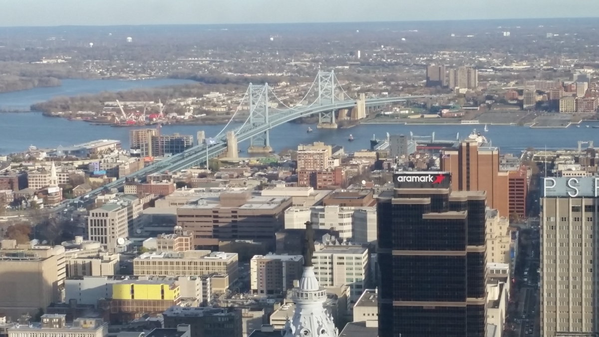 William Penn atop City Hall is in the foreground with the Benjamin Franklin Bridge in the background William Penn atop City Hall is in the foreground with the Benjamin Franklin Bridge in the background
