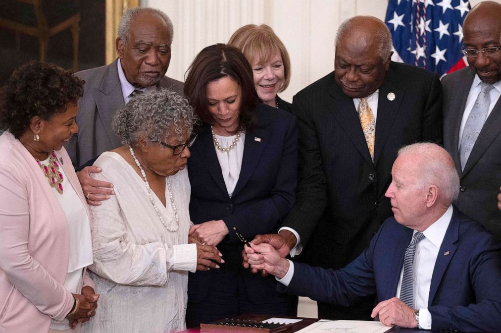 After signing the act that made Juneteenth a Federal Holiday, President Biden hands the pen he used to Activist Opal Lee After signing the act that made Juneteenth a Federal Holiday, President Biden hands the pen he used to Activist Opal Lee
