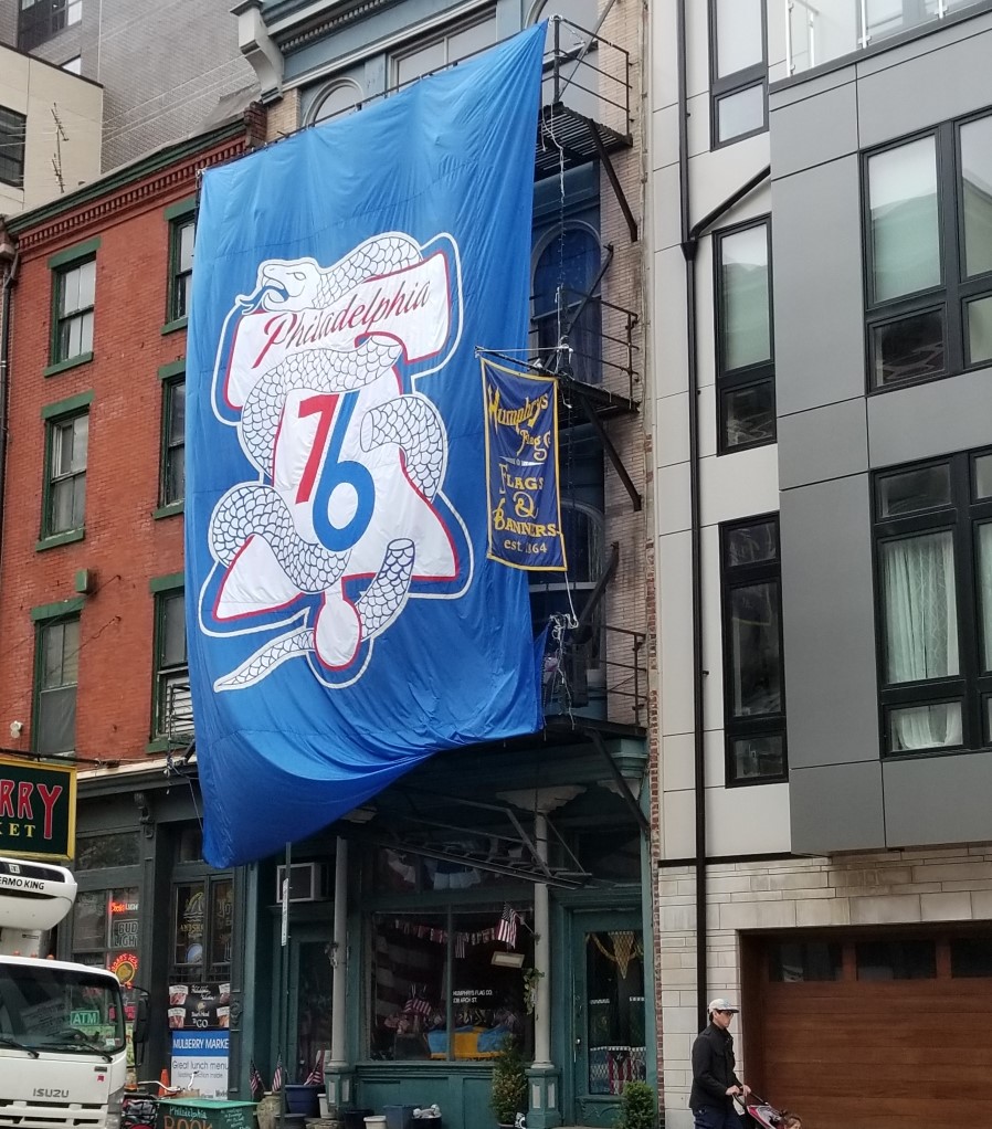 Humphrys Flag Company Displaying a Large Custom Flag for the Philadelphia 76ers NBA Team