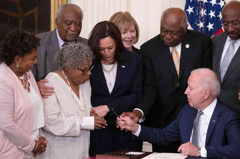 After signing the act that made Juneteenth a Federal Holiday, President Biden hands the pen he used to Activist Opal Lee